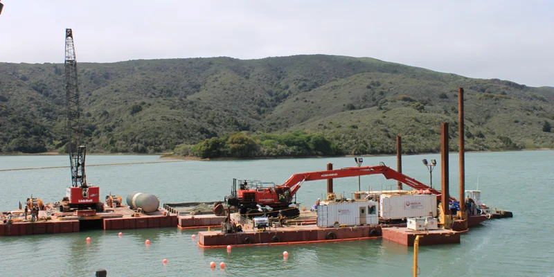 Barges Floating Heavy Equipment on a Hydro Project